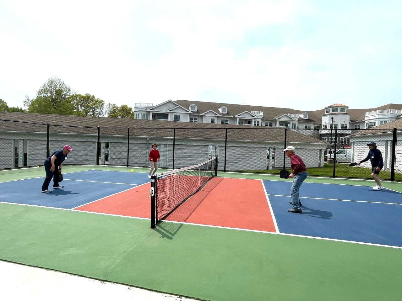 Senior living residents playing pickleball at StoneRidge