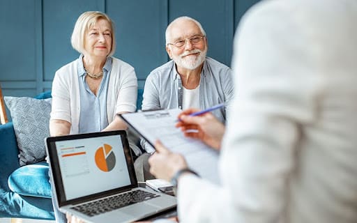 senior couple meeting with a doctor for health results