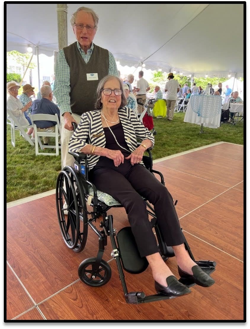 Senior woman in wheelchair enjoying an event