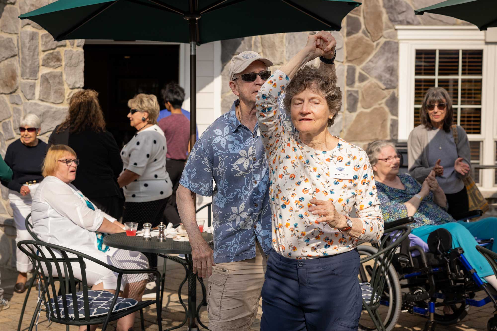 senior couple dancing at StoneRidge's First Clothing Drive