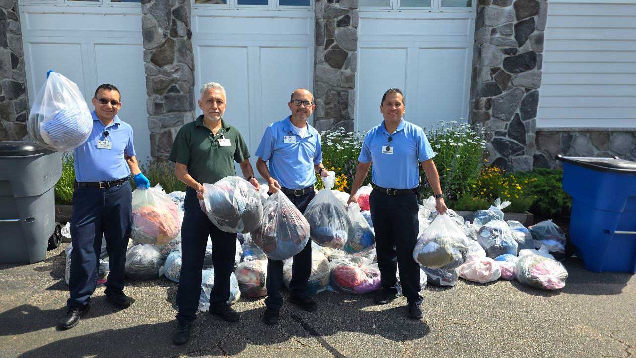 Clothing_Drive_3 StoneRidge team members holding bags of clothes for First Clothing Drive