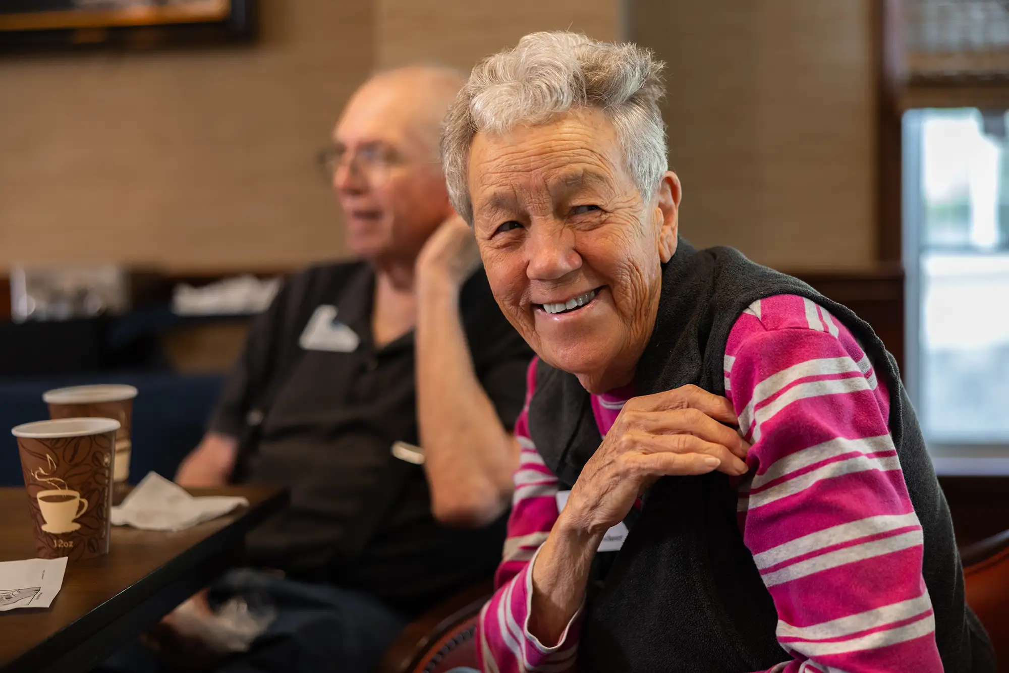 Senior woman and man smiling at Stoneridge