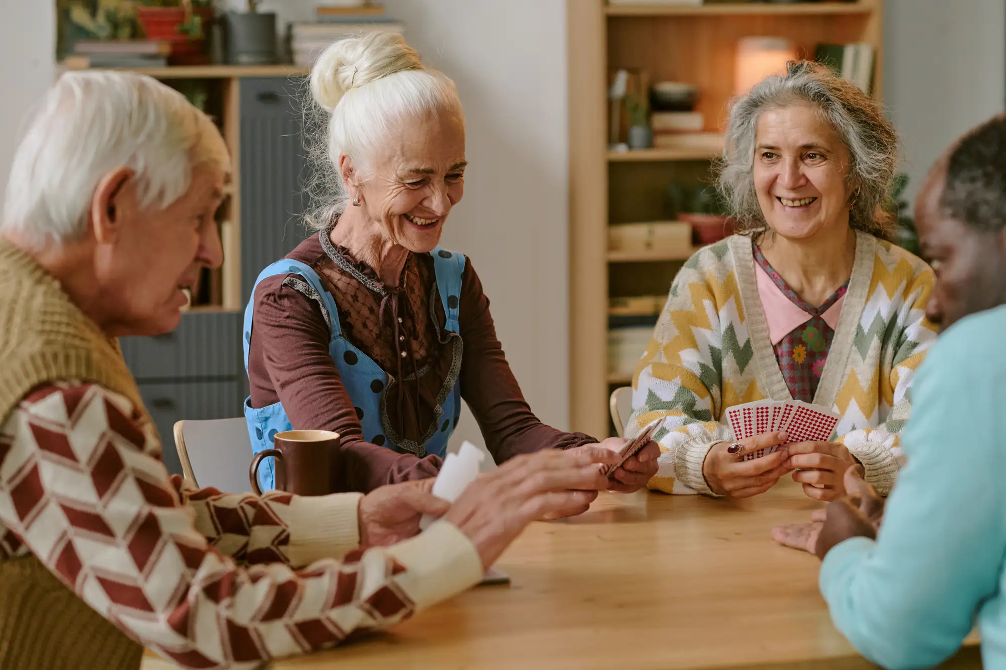 couples play cards and enjoy senior companionship