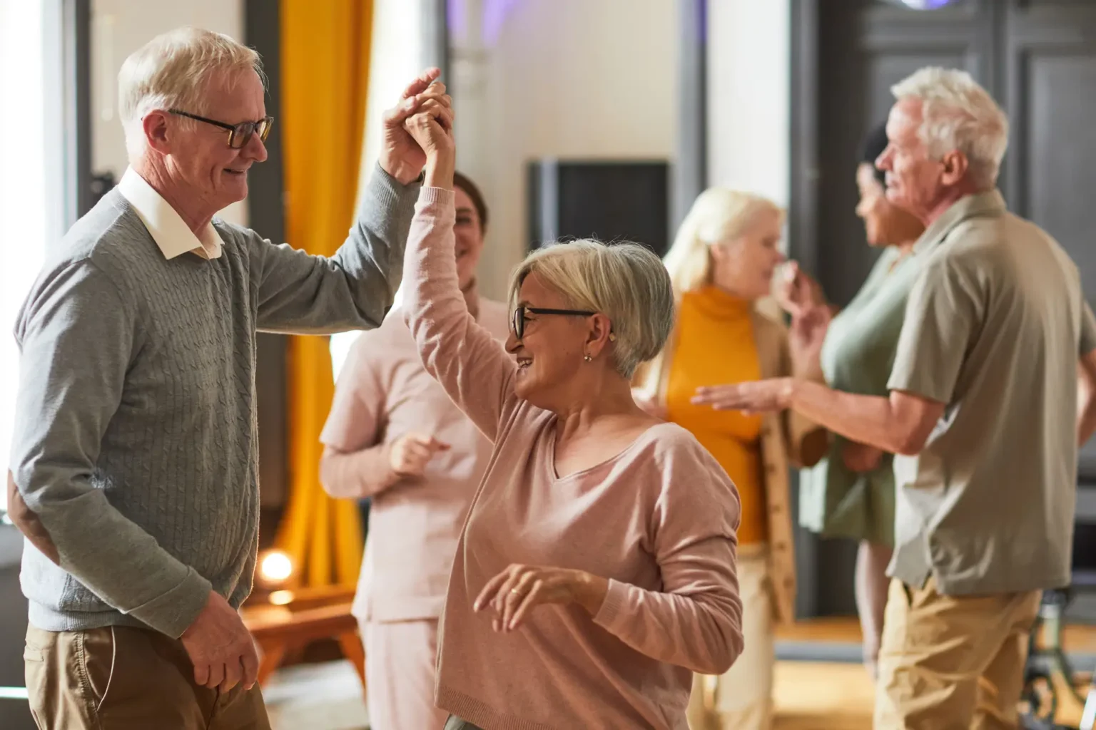dancing senior couple gives social connection a whirl