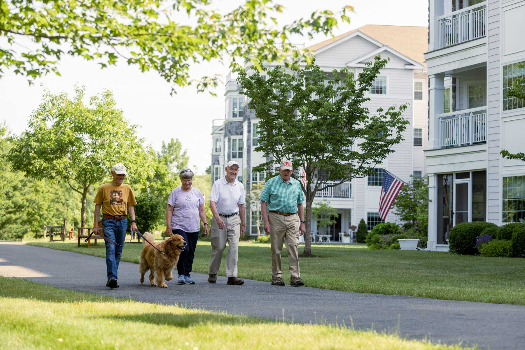 a group of seniors taking their dog on a walk