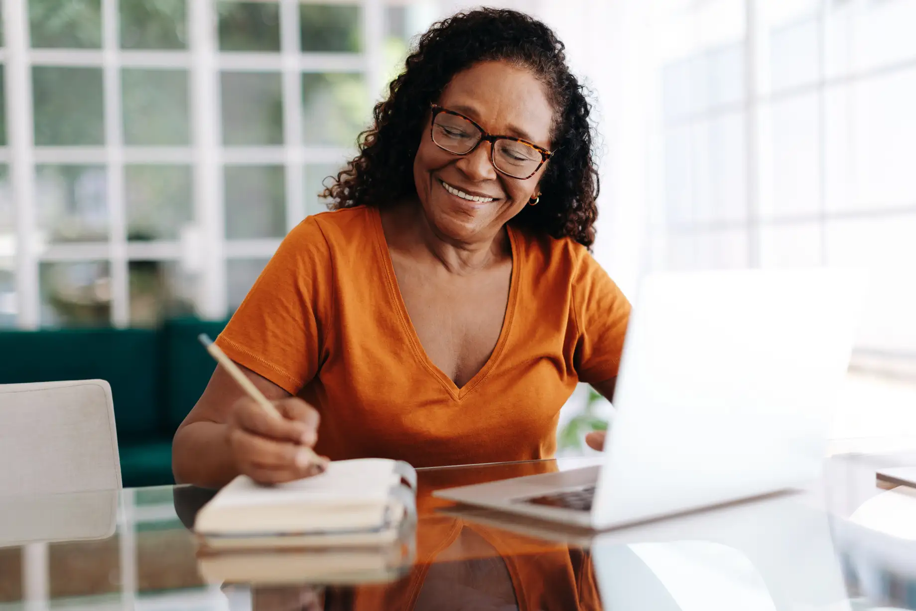 Senior woman planning her retirement on her laptop computer